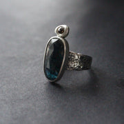 textured silver  ring with a large dark blue green stone and smaller brown diamond by Cornwall jeweller Carin Lindberg