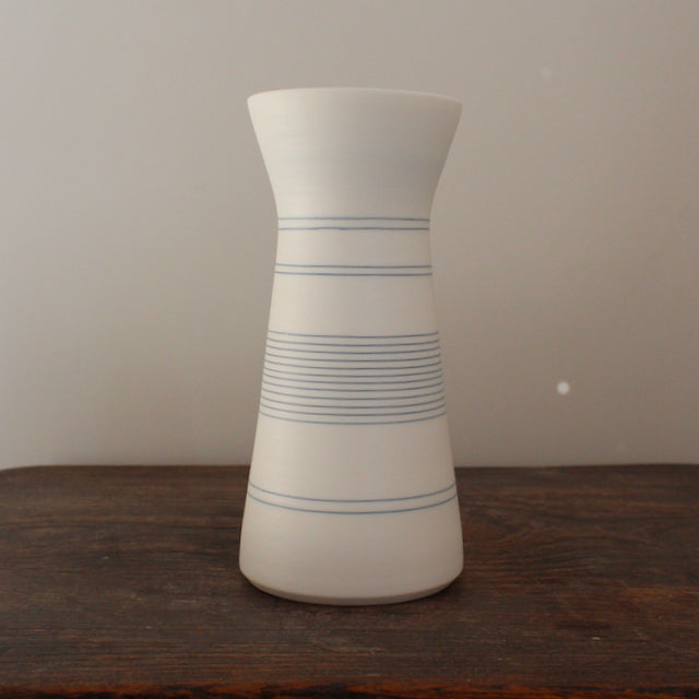 white porcelain vase with blue ring design by Uk potter Kathryn Sherriff of By the Line Pottery