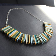 Modern deco necklace with greens, yellows and blues by Clare Lloyd