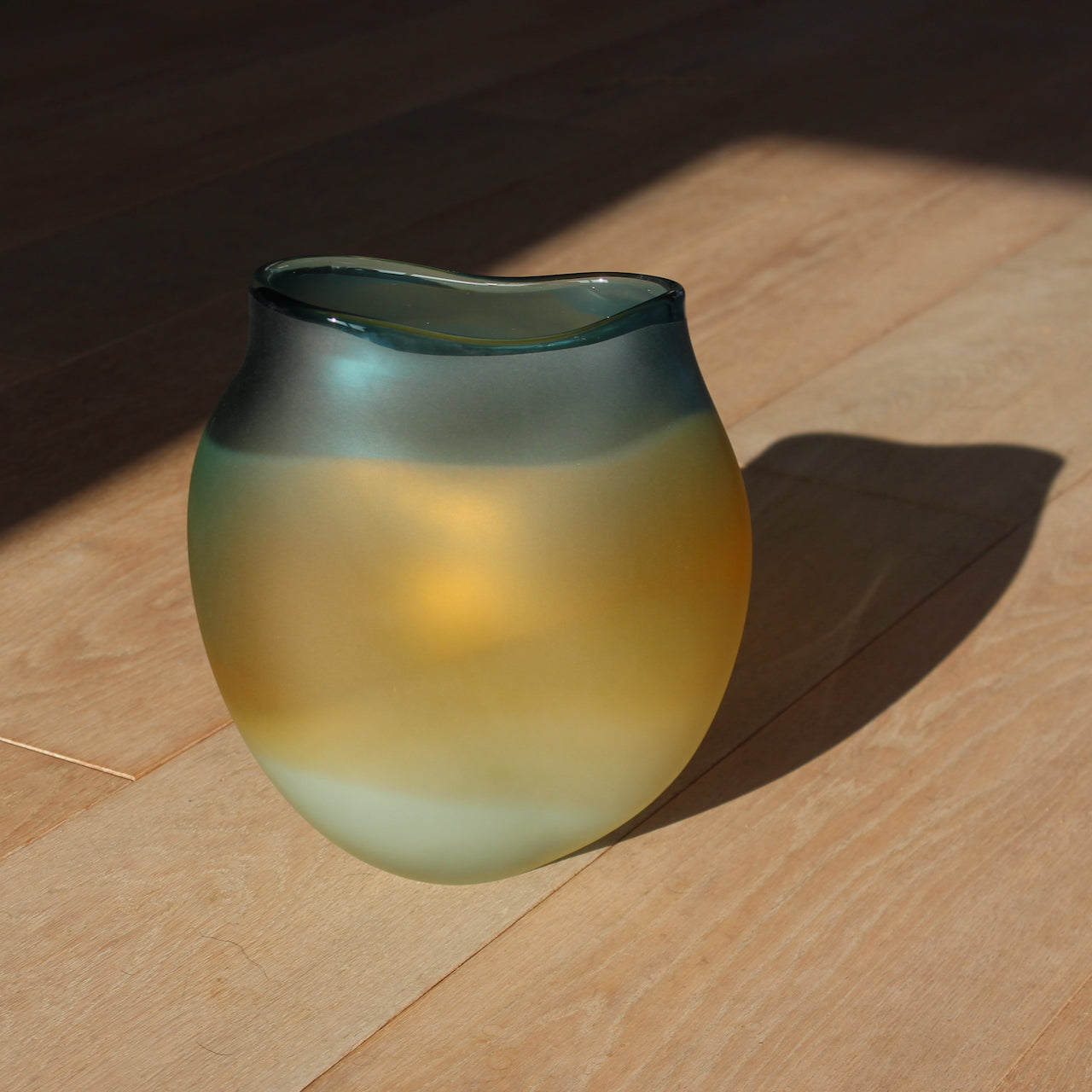 glass artist Michele Oberdieck's tulip shaped glass vessel in opaque blue and amber glass