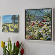 two paintings of spring flowers in fields by Cornwall artists Imogen Bone and Jill Hudson