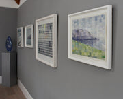 Abstract paintings on a grey wall