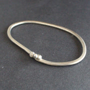 silver bangle by UK jeweller Lizzie Weir, Anatole Design.