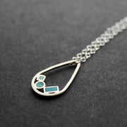silver necklace with blue details