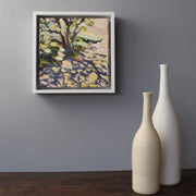 Jill Hudson abstract oil painting framed and on a grey wall next to two ceramic bottles by UK ceramicist Lucy Burley
