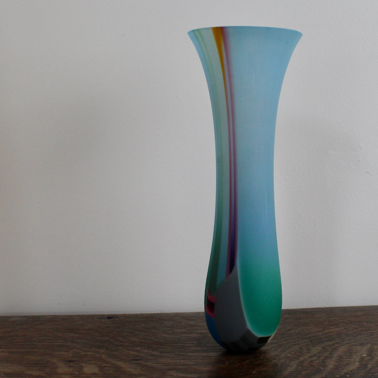 a blue glass vase with yellow stripe by UK glass artist Ruth Shelley.