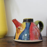 A John Pollex brightly coloured ceramic tea pot.