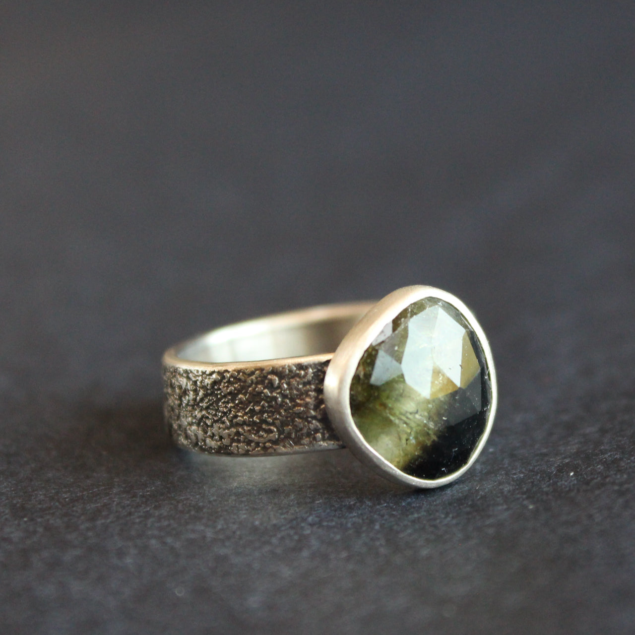 textured silver ring with a dark green stone by UK jeweller Carin Lindberg
