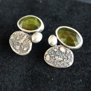 a pair of silver stud earrings with a green stone set in silver by Carin Lindberg UK jewellery designer