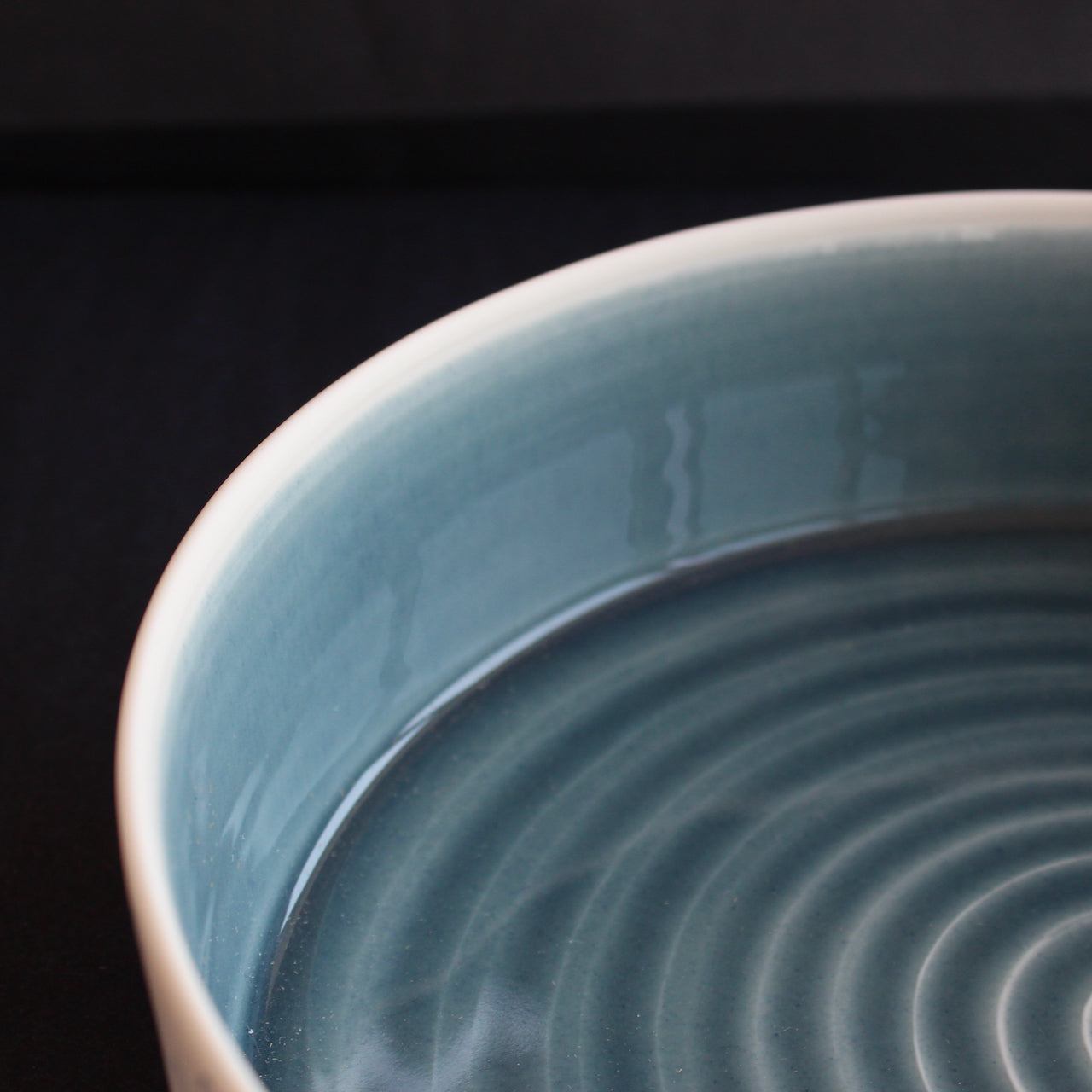 interior detail of blue glazed porcelain serving dish by Kathryn Sherriff of By the Line Pottery