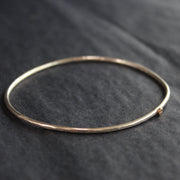fine sliver bangle with small gold star by Cornwall jewellery designer Lucy Spink