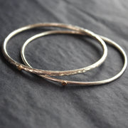 pair of narrow silver bangles by Cornwall jewellery designer Lucy Spink