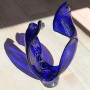 a tall blue glass sculpture with white detail by UK glass artist Benjamin Lintell 