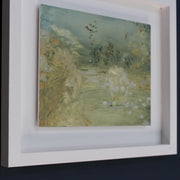 a framed Katy Brown abstract painting in pale blue, grey and gold of a country garden.