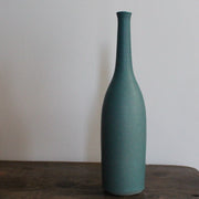 a hand thrown teal coloured ceramic bottle by UK ceramic artist Lucy Burley