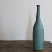 a teal coloured ceramic bottle by UK ceramicist Lucy Burley.