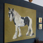 Jill Hudson painting of a large black and white horse on a mustard coloured background