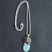 Aquamine and beach pebble pendant on silver chain by Carin Lindberg