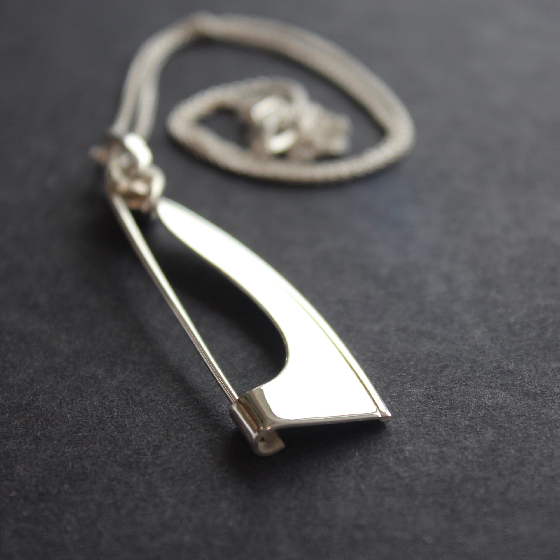 Abstract silver Ancien pendant/brooch by Beverly Bartlett with chain