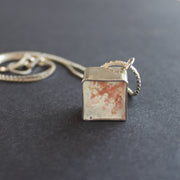 Cube pendant made from silver and cement by Amy Stringer