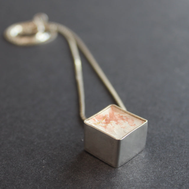 Cube pendant made from silver and cement by Amy Stringer