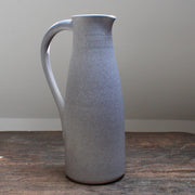 a soft grey coloured ceramic jug with handle by Lucy Burley