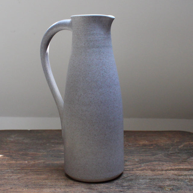 a soft grey coloured ceramic jug with handle by Lucy Burley