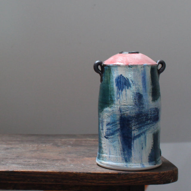 A blue and green ceramic vase with a tapered top and small lug handles by John Pollex British ceramicist,