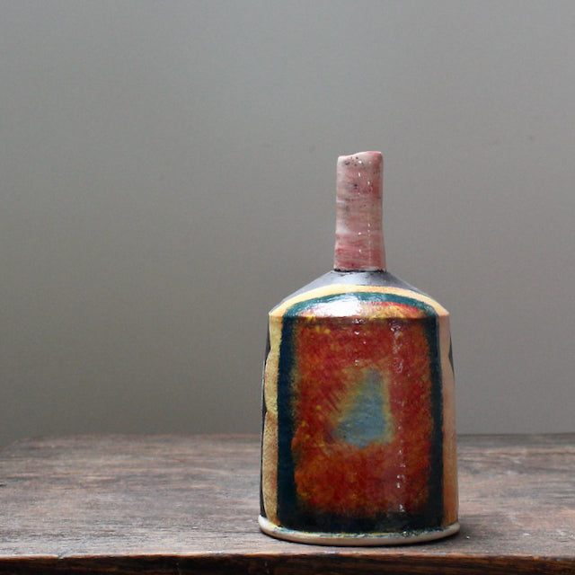 A brightly coloured ceramic  bottle by well known potterJohn Pollex.