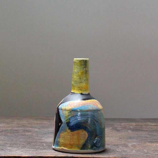 A small ceramic bottle with multi coloured glazes by leading UK ceramicist John Pollex