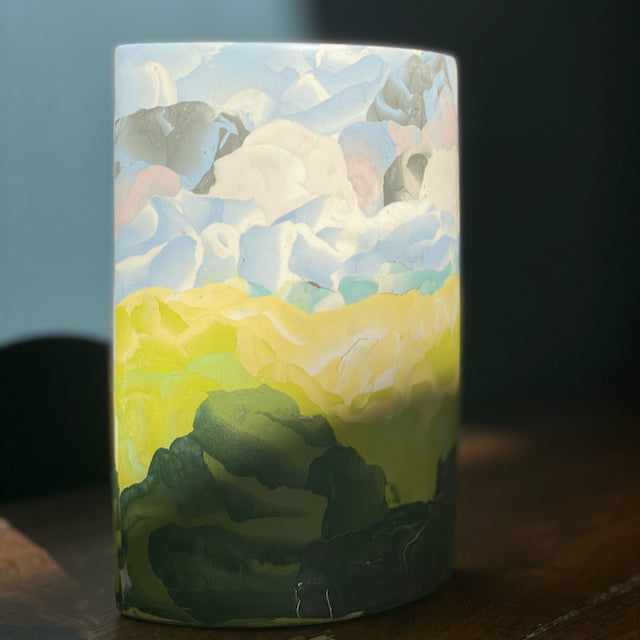 a green, blue, pink and yellow ceramic vase in the Nerikomi style by Essex based ceramic artist Judy McKenzie.