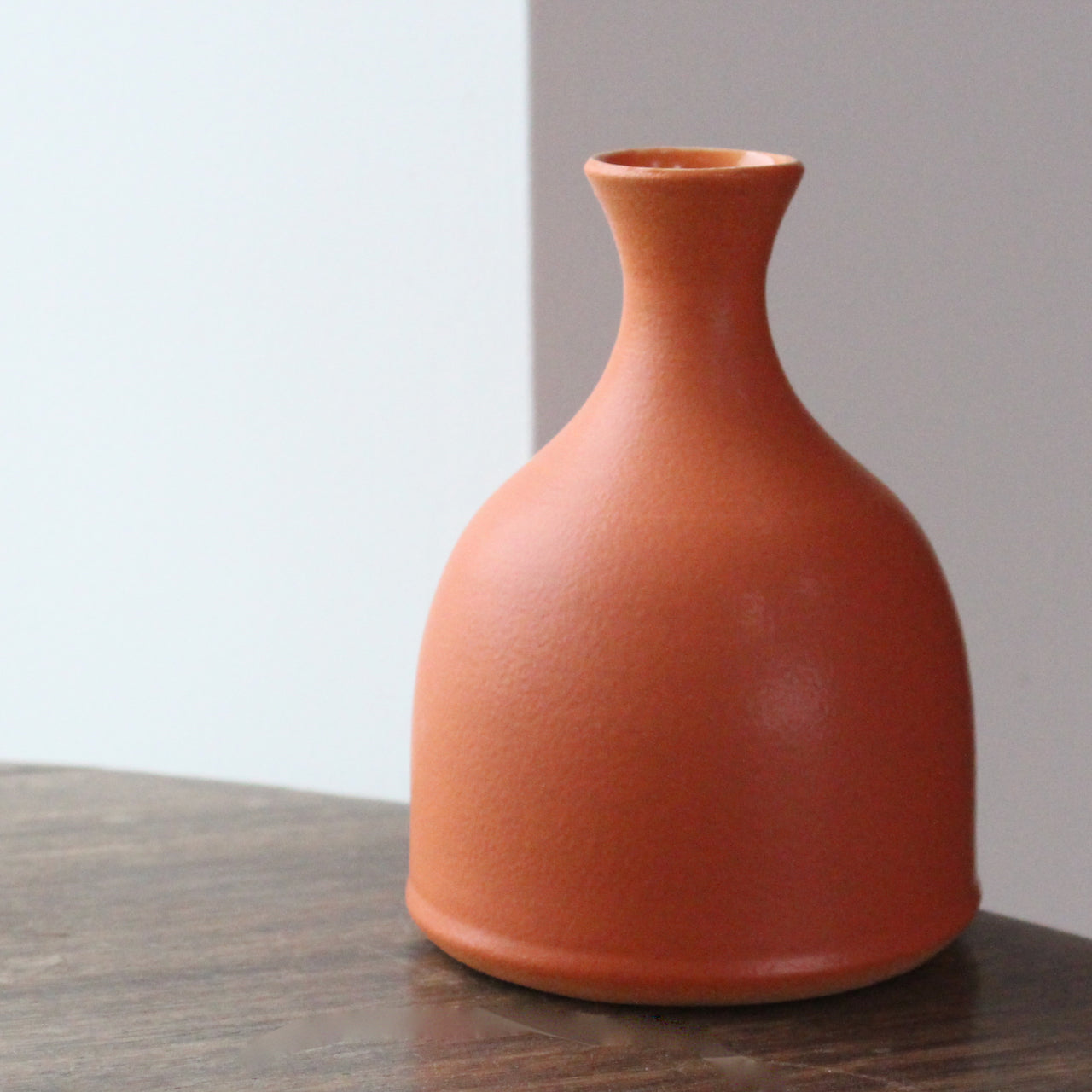  Lucy Burley small orange coloured ceramic bud vase 
