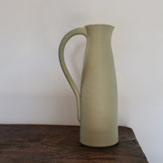 a pale olive ceramic jug by UK ceramicist Lucy Burley.
