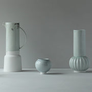Tall pale green and white ceramic vase with handle, small pale green round bowl and tall pale green vase with round bottom and straight top