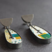 leaf shaped earrings in silver and printed aluminium in yellow, blue and green by jewellery designer  Lindsey Mann