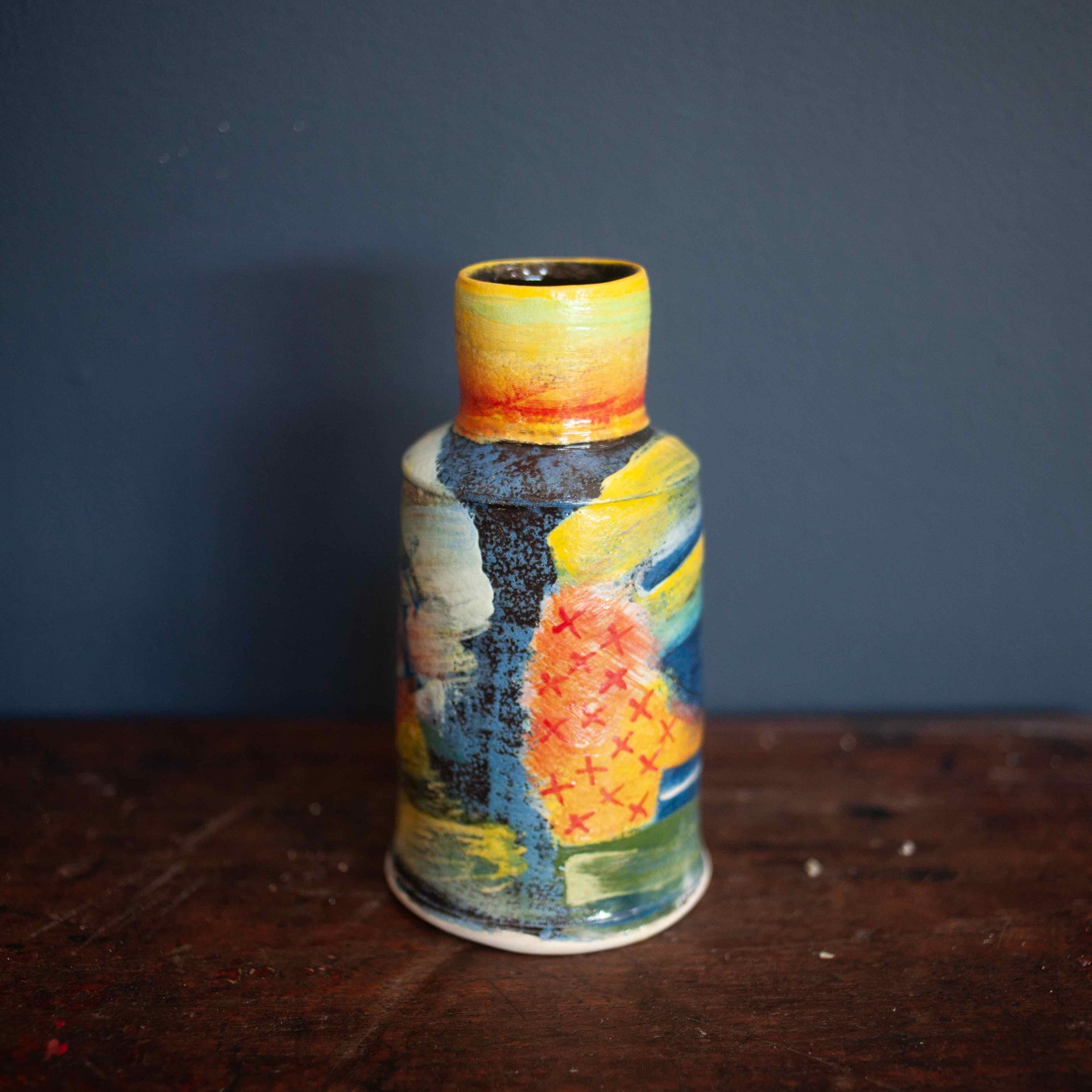 A colourful vase by John Pollex