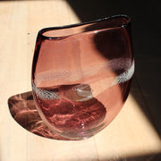 purple glass vessel with centre detail by Benjamin Lintell  photographed in sunlight from above.