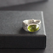 Carin Lindberg - Peridot ring in textured sterling silver with textured leaf detail