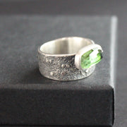 Carin Lindberg - Green tourmaline ring in textured sterling silver closeup on raised display box