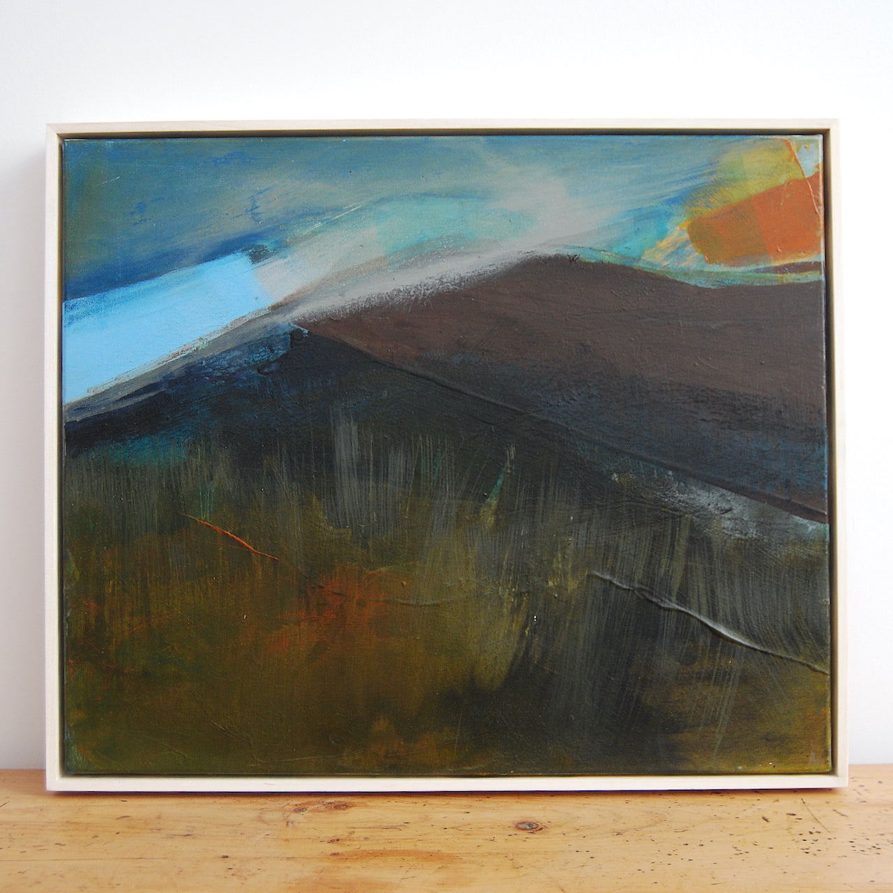 abstract painting by Alice Robinson-Carter of Rame Head peninsula in Cornwall, the peninsula is dark against a blue sky with an orange setting sun