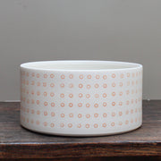 porcelain dish decorated with small orange circles