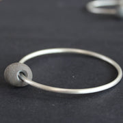Beach pebble silver abstract bangle by Carin Lindberg