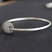 Beach pebble silver abstract bangle by Carin Lindberg