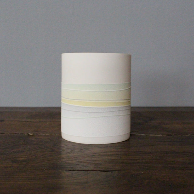 ceramic pot with pastel line decoration 