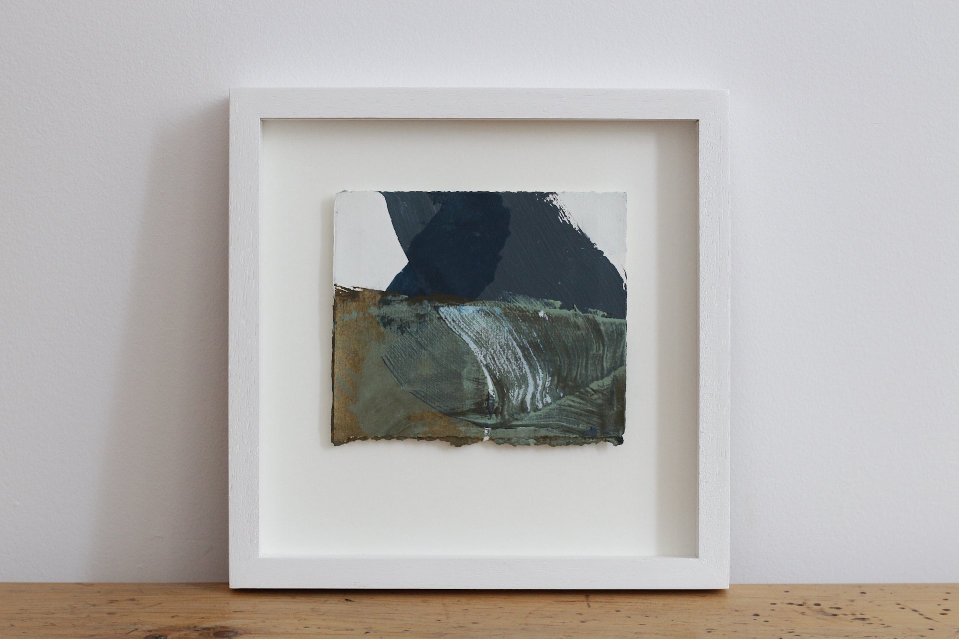 Abstract landscape painting of dark blue sea and textured rocks by Devon based artist
