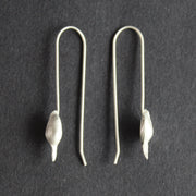 Silver drop earrings shaped like seedpods