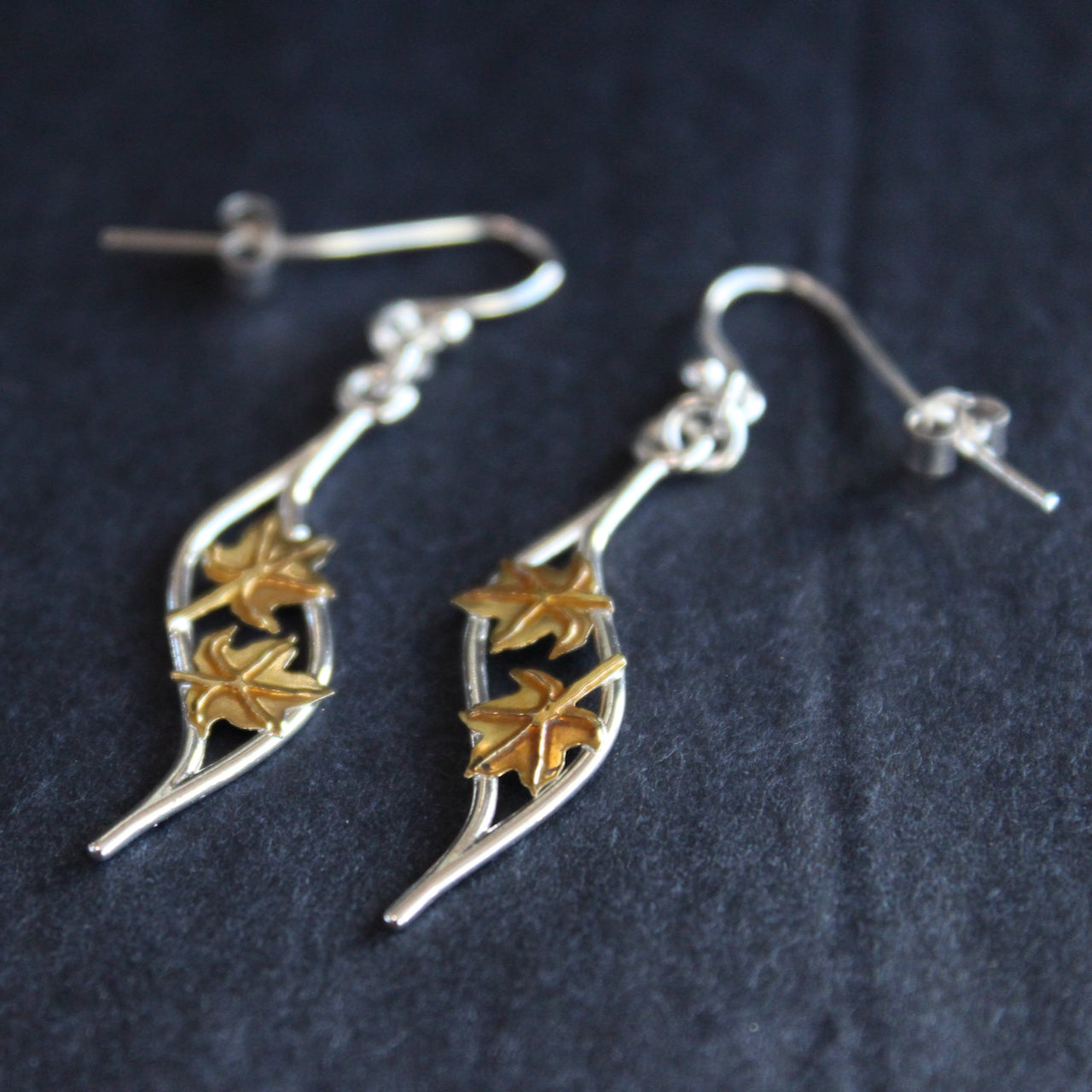 Plantae wave earrings with gold leaves by Beverly Bartlett