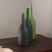 a trio of ceramic bottles in different shades of green and incremental sizes by Lucy Burley UK ceramicist