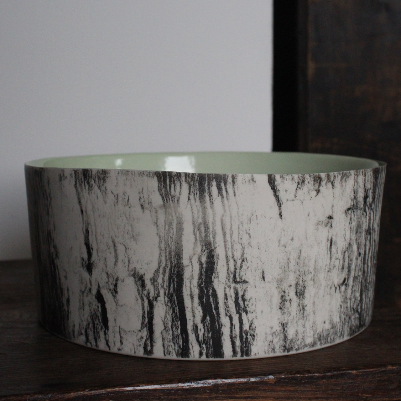 ceramic bowl with a green interior glaze and a black and white tree bark effect on exterior by Heidi Harrington, UK ceramicist