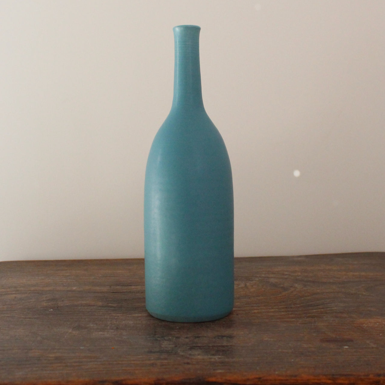 dark turquoise coloured ceramics bottle by English ceramicist Lucy Burley